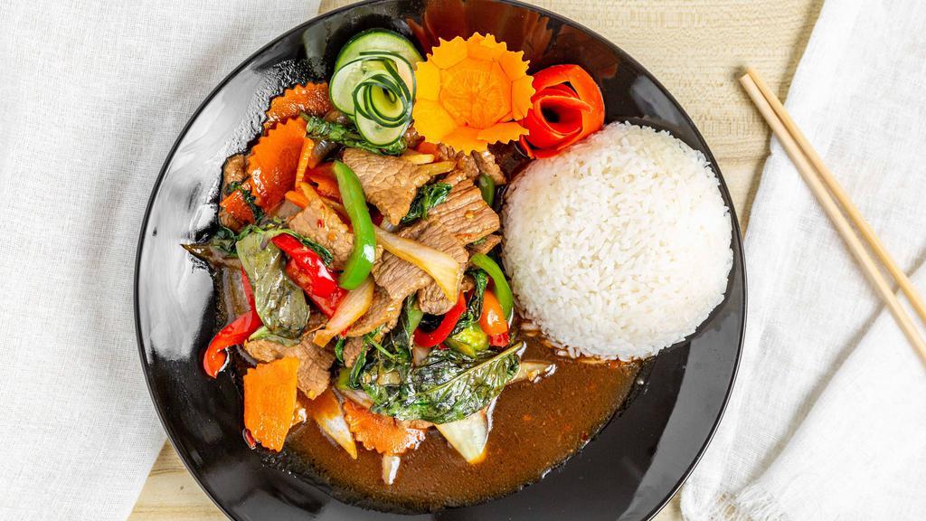 Stir-Fry Basil · Stir-fried garlic, chili, onions, bell peppers, carrots and Thai basil in a spicy chili sauce. Served with rice.