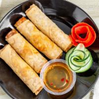 Egg Rolls · Crispy rolls stuffed with marinated, silver noodle, taro, cabbage and carrots; served with s...