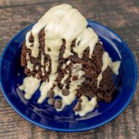 Carob Cake · Carob Cake sweetened with Coconut Sugar and topped with a Cashew Cream Drizzle.