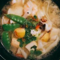 Hu Tieu Seafood · Wide rice noodle, fish balls, fish fillets, shrimps, scallions, cilantro.