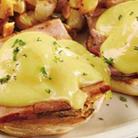 Eggs Benedict · House Specialty! Two poached eggs over Ozark Ham on extra large Thomas' English Muffin halve...