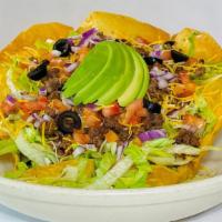 California Taco Salad · Large crisp flour tortilla filled with seasoned fresh ground beef and topped with shredded J...
