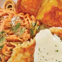 Parmesan Crusted Chicken & Pasta · A fresh Parmesan-breaded chicken breast grilled to a golden brown perfection, served over a ...