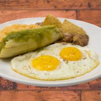 Breakfast Plate · Two Eggs, One Tamale and Rice and Beans.