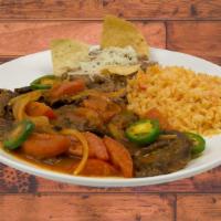 Bistec Ranchero Plate · Chop steak with Onion, Jalapenos, Tomateo, and Rachero Sauce Comes Rice and Beans and 3 Tort...