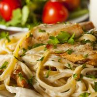 Fettuccine Chicken Alfredo · Our delicious homemade alfredo sauce on a bed of fettuccine pasta dusted with Parmesan chees...