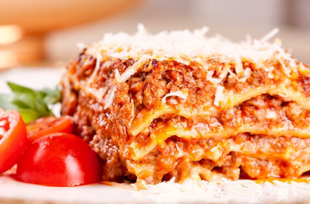 Meat Lasagna · Layers of pasta, Ricotta cheese, and hearty meat sauce baked and covered with Mozzarella cheese.
