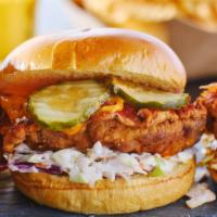 Buffalo Chicken Sandwich · Toasted Brioche Bun, Breaded Chicken tossed in Buffalo, Coleslaw, pickles and Ranch