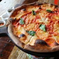 Pizza Del Giardino · Tomato + mozzarella + tsun dried tomato confit + artichoke hearts + onions + mushrooms + gor...
