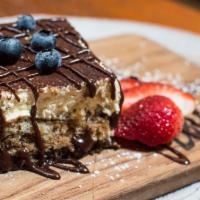 Tiramisu Dello Chef · lady finger cake + espresso + chocolate shavings + white chocolate shavings + mixed berries