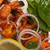 Shrimp Tandoori · Jumbo shrimp marinated in yogurt and spices, grilled on skewers.