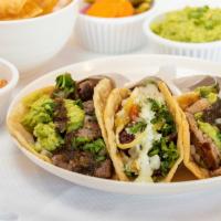 Carne Asada · 100% certified Angus beef. Flame grilled angus steak, cilantro, onion, guacamole and salsa.