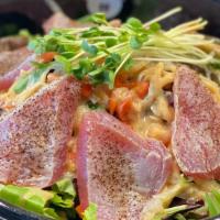 Tuna Tataki Salad · Thinly sliced seared tuna over mixed greens served with house made ginger dressing.