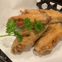 Crispy Chicken Wing · Deep fried chicken wing served with Jamaican jerk seasoning.