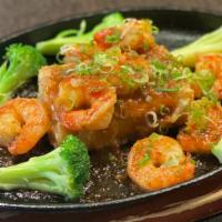 Lava Shrimp · Sautéed shrimp served over deep fried tofu with sweet chili sauce.