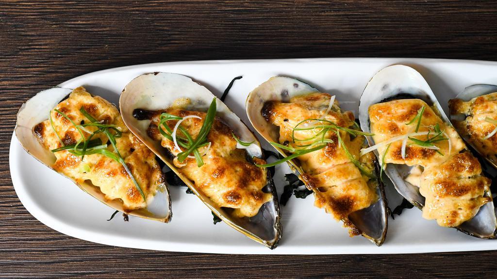 Baked Mussels · New Zealand mussel on half shell broiled in creamy caviar sauce.