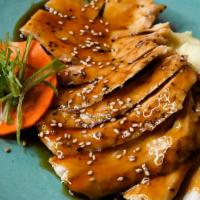 Chicken Teriyaki · Chicken Teriyaki served with mashed potato, sliced red radish, topped with sesame seed and s...