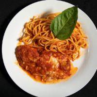 Chicken Parmigiana · Traditional chicken Parmesan served with spaghetti with our homemade marinara sauce.