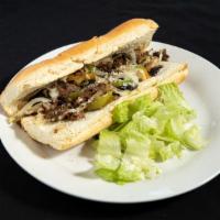 Philly Cheesesteak · Flank steak, Alfredo sauce, bell peppers topped with cheese.