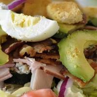 Cobb Salad · Generous portions of turkey, ham, bacon, fresh Bleu cheese, avocado, tomatoes, pepperoncini,...