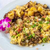 Huevos Con Machaca · Scrambled eggs with shredded beef tomatoes, onions and peppers.