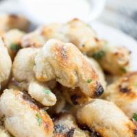 Garlic Knots · Our neapolitan dough tied into knots, baked and coated with garlic oil, italian parsley and ...