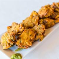 Vegetable Pakora · Fried fritters made with mixed vegetables coated in chickpea batter