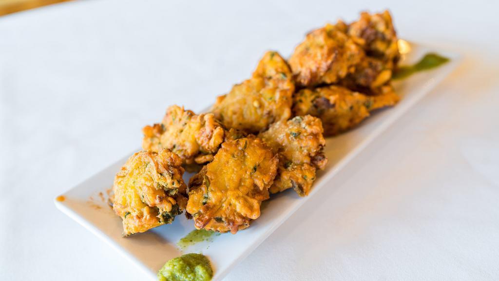 Vegetable Pakora · Fried fritters made with mixed vegetables coated in chickpea batter