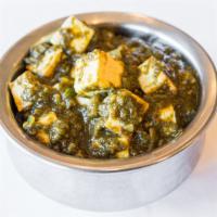 Saag Paneer (Gf) · Cottage cheese and spinach slow-cooked in an onion-based ginger-garlic sauce
