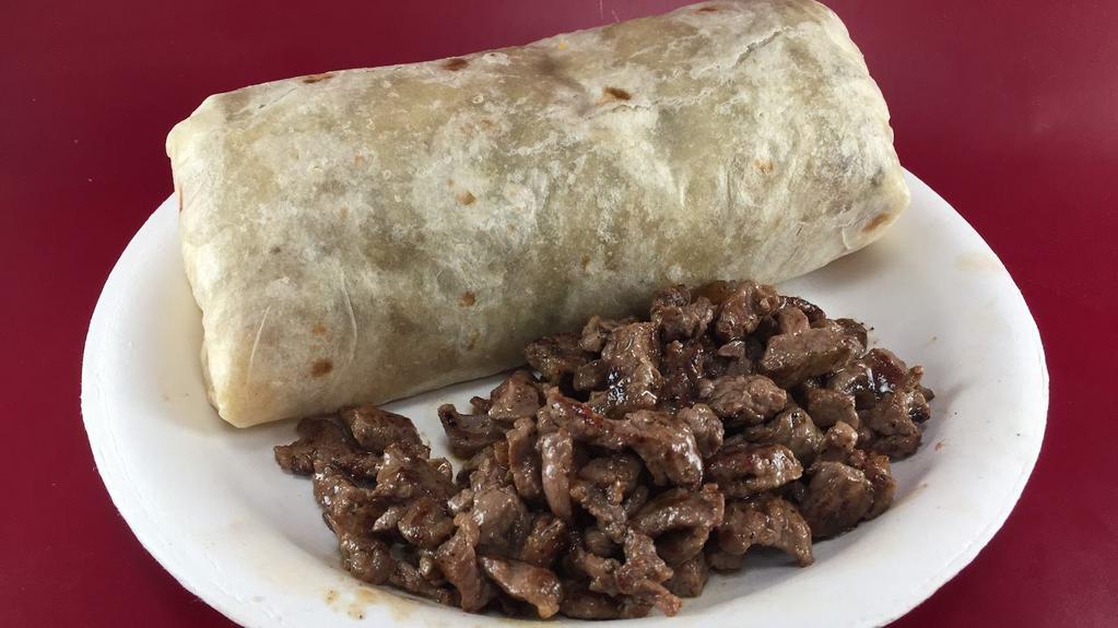 Steak Egg Burrito · THIS IS THE HOT ONE -Come with eggs, hash brown,  5 oz. Chop Rib Eye Steak and Cheddar Cheeses  ( Home made Salsa on the side)
