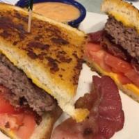 Grilled Pastrami Melt · A pound of pastrami on grilled rye with Jack cheese.