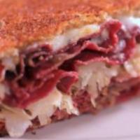 Pastrami Sandwich · Classic peppery pastrami with lettuce, tomato, and red onion on your choice of bread.