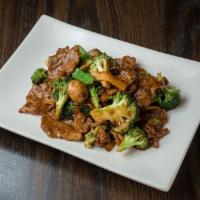 Beef With Broccoli · Beef sautéed with mushrooms, broccoli, and snow peas in a chef's brown sauce.