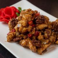 Ku Ting Crispy · Choice of tender meat deep fried in a light batter sautéed with honey walnuts in chef's spec...