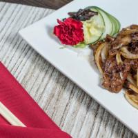 Black Pepper Beef (Lunch) · Tender sliced steak sautéed with onions in a black pepper steak sauce. Served with fried ric...