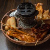 Pu Pu Platter · Assorted appetizers with two pieces of shanghai egg roll, two pieces of fried shrimp, two pi...