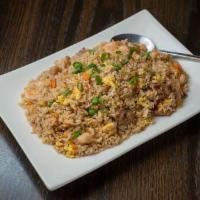 Fried Rice · Wok-tossed rice with egg, green onions, peas, diced carrots, and choice of meat. Cooked to o...