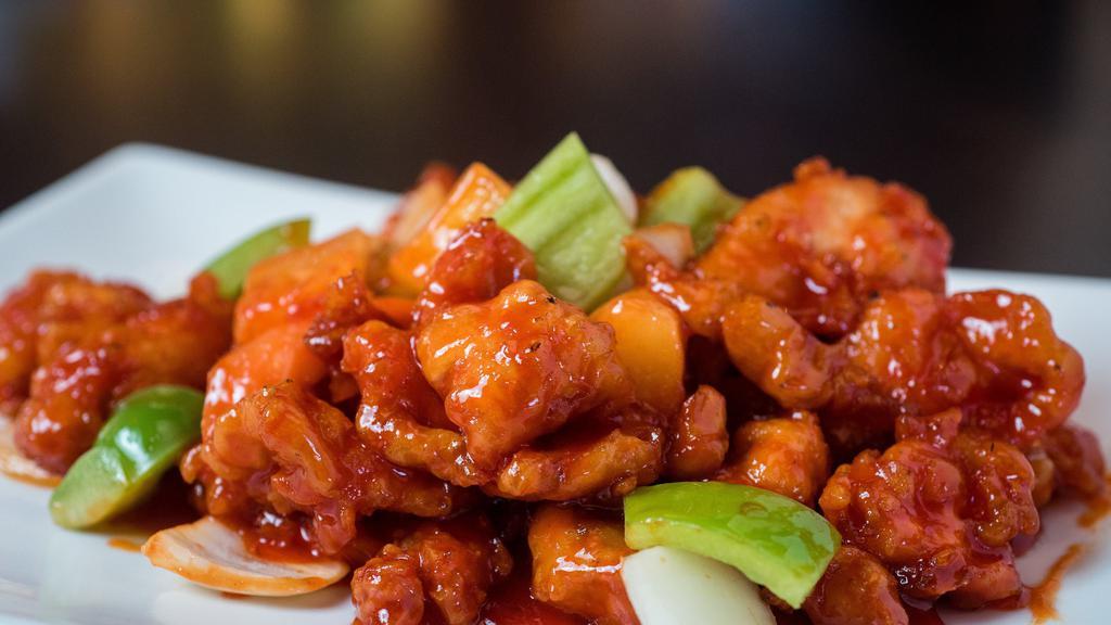 Sweet & Sour · Lightly battered meat stir-fried in a sweet & sour sauce, onions, green peppers, and pineapple.