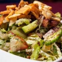 Fattoush · Lettuce, cucumber, and tomatoes tossed in a vinaigrette dressing with sumac, garlic and pita...