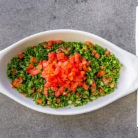 Tabbouleh · Finely chopped tomatoes, parsley, mint, and onion. Seasoned with olive oil, lemon juice, and...