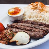 Aleppo Kofta · Minced beef blended with spices char-grilled over mesquite, served with rice.