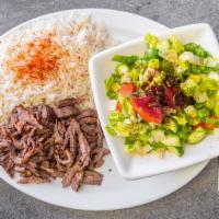 Beef Shawarma · Grilled strips of seasoned  beef served with hummus, rice and salad.