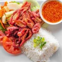 Pork Chitterlings On Rice · Deep-fried Pork Chitterlings, green onion sauce, kimchi Khmer style, cucumber, tomato, and h...