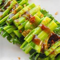 Chinese Broccoli Oyster Sauce · Steamed Chinese broccoli topped with sweet oyster sauce and roasted garlic.