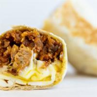Sausage Burrito · 3 sunny side up eggs, sausage, white american cheese, crispy tots, caramelized onions, spicy...