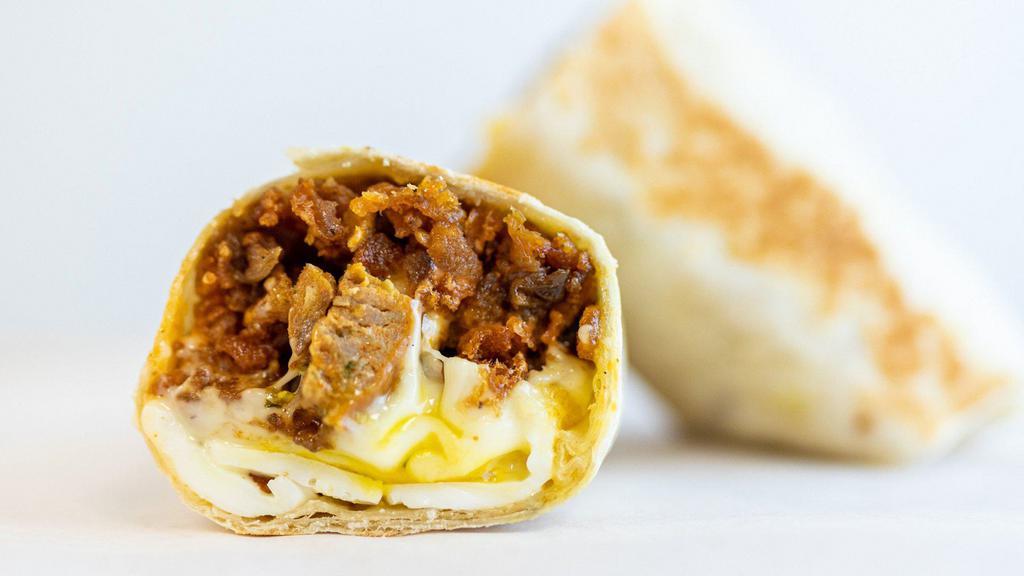 Sausage Burrito · 3 sunny side up eggs, sausage, white american cheese, crispy tots, caramelized onions, spicy mayo