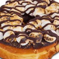 S'Mores Raised · Chocolate iced donut with mini marshmallows. Topped with a chocolate drizzle and graham crac...