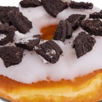 Oreos Raised · Chocolate or vanilla iced donut with oreo pieces on top.