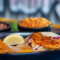 Family Pack (Surf'S 4-6) · 12 pieces of grilled chicken, rice, beans, salad, tortillas, chips and salsa.