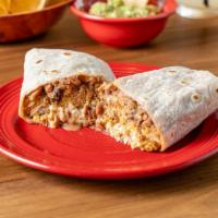 Carnitas Burrito · Carnitas, creamy guacamole, melted cheese, chopped lettuce, warm rice and pinto beans rolled...